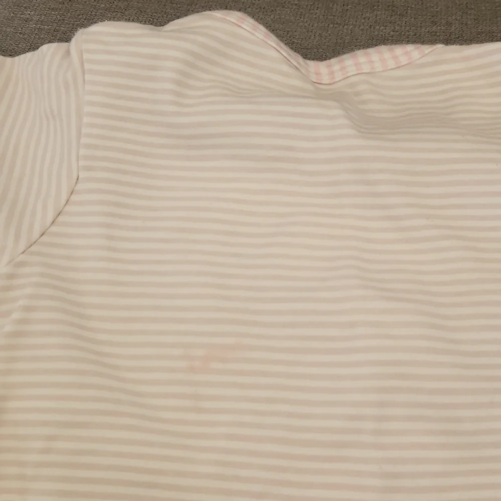 One Piece footed soft pink bodysuit